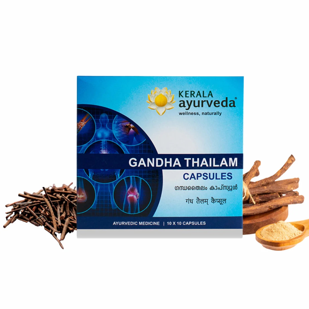 Studio product shot of the Gandha Thailam Capsules carton flanked by licorice roots and sesame twigs, emphasising its herbal composition – Kerala Ayurveda India
