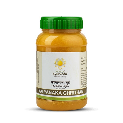 Front view of a clear plastic jar with a green lid, filled with yellow Kerala Ayurveda Kalyanaka Ghritham. The label prominently displays the product name in English and Malayalam, along with the Kerala Ayurveda logo. – Kerala Ayurveda India