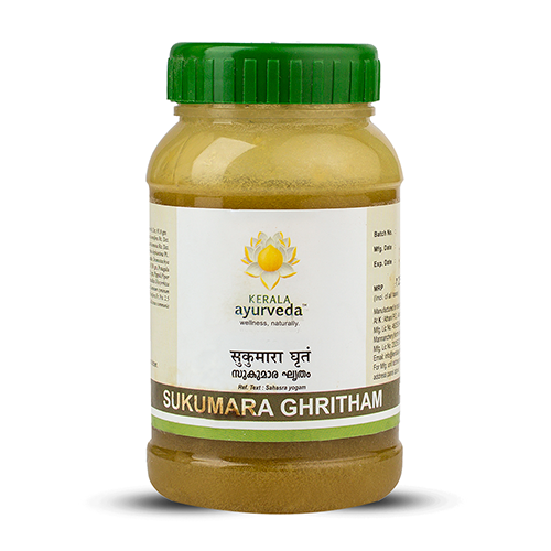 Front view of a clear plastic jar with a green lid, filled with a yellowish-brown substance, labeled as Kerala Ayurveda Sukumara Ghritham. The product name is displayed in English and Malayalam script with the Kerala Ayurveda logo. – Kerala Ayurveda India