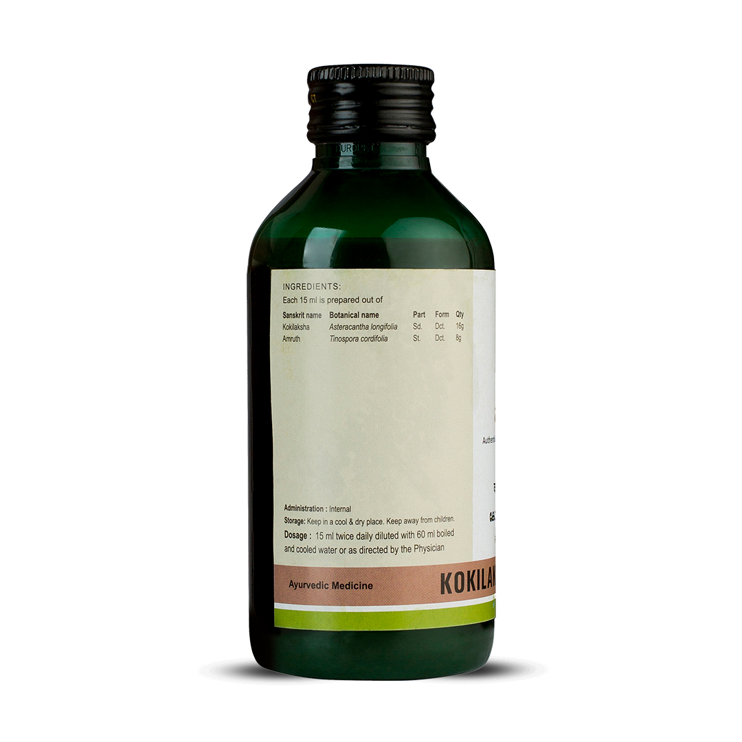 Side view of the dark green glass bottle of Kerala Ayurveda Kokilakshakam Kwath, showing a detailed list of ingredients prepared per 15 ml, including Sanskrit and botanical names like Kokilaksha and Amruth. Administration, dosage (15 ml twice daily diluted with 60 ml water), and storage instructions are also visible. – Kerala Ayurveda India
