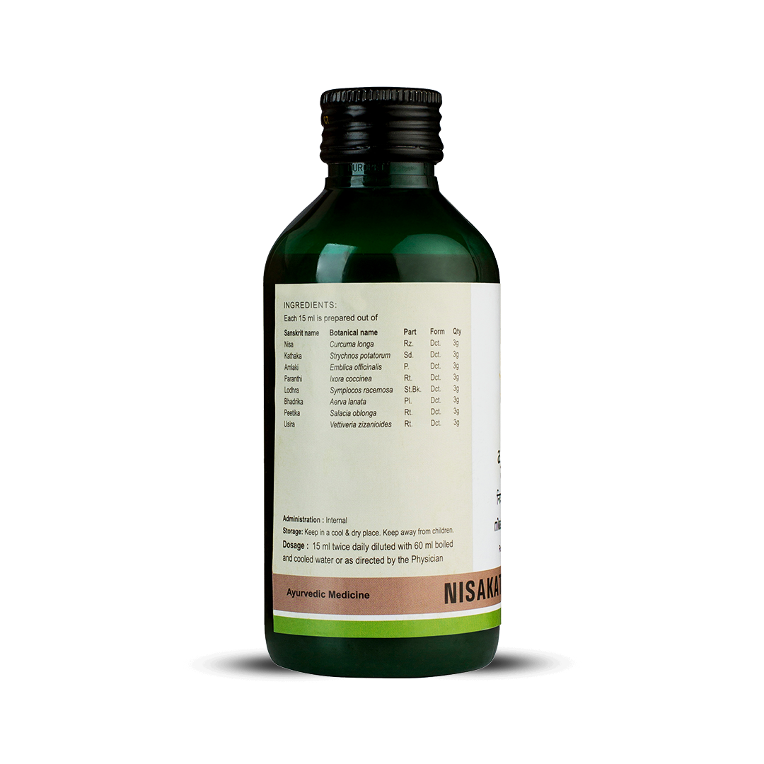 Side view of the dark green glass bottle of Kerala Ayurveda Nisakathakadi Kwath, showing a detailed list of ingredients prepared per 15 ml, including botanical names like Curcuma longa and Strychnos potatorum. Administration, dosage (15 ml twice daily diluted with 60 ml water), and storage instructions are also visible. – Kerala Ayurveda India