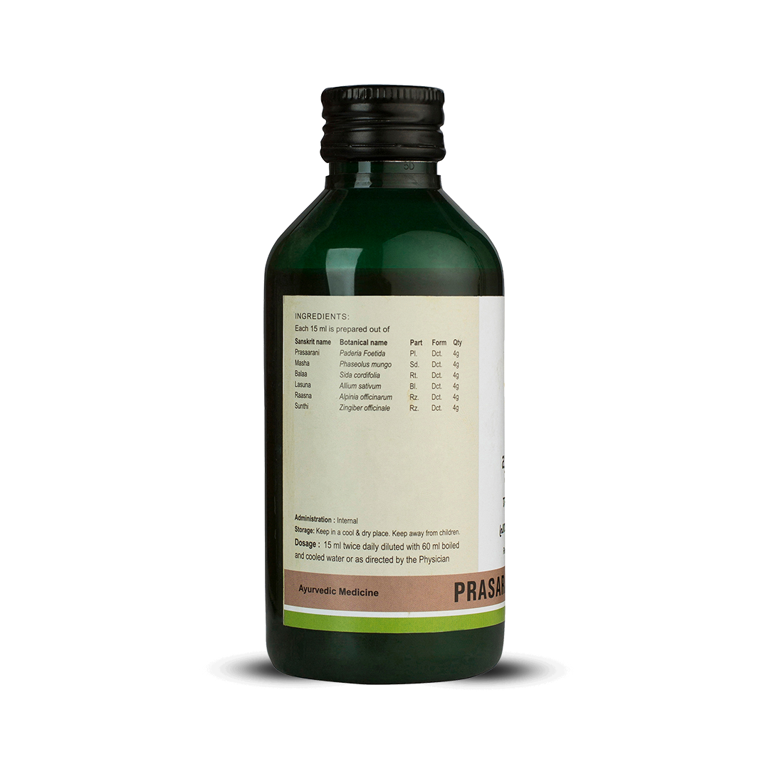 Side view of the dark green glass bottle of Kerala Ayurveda Prasaranyadi Kwath, showing a detailed list of ingredients prepared per 15 ml, including Sanskrit name, botanical name, part, form, and quantity. Administration, dosage (15 ml twice daily diluted with 60 ml water), and storage instructions are also visible. – Kerala Ayurveda India