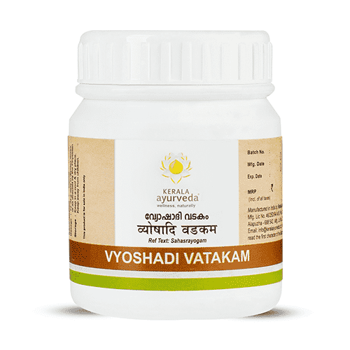 Front view of Kerala Ayurveda Vyoshadi Vatakam: white 50 g plastic jar with screw lid, lotus logo, bilingual product name and brown-green accent band.