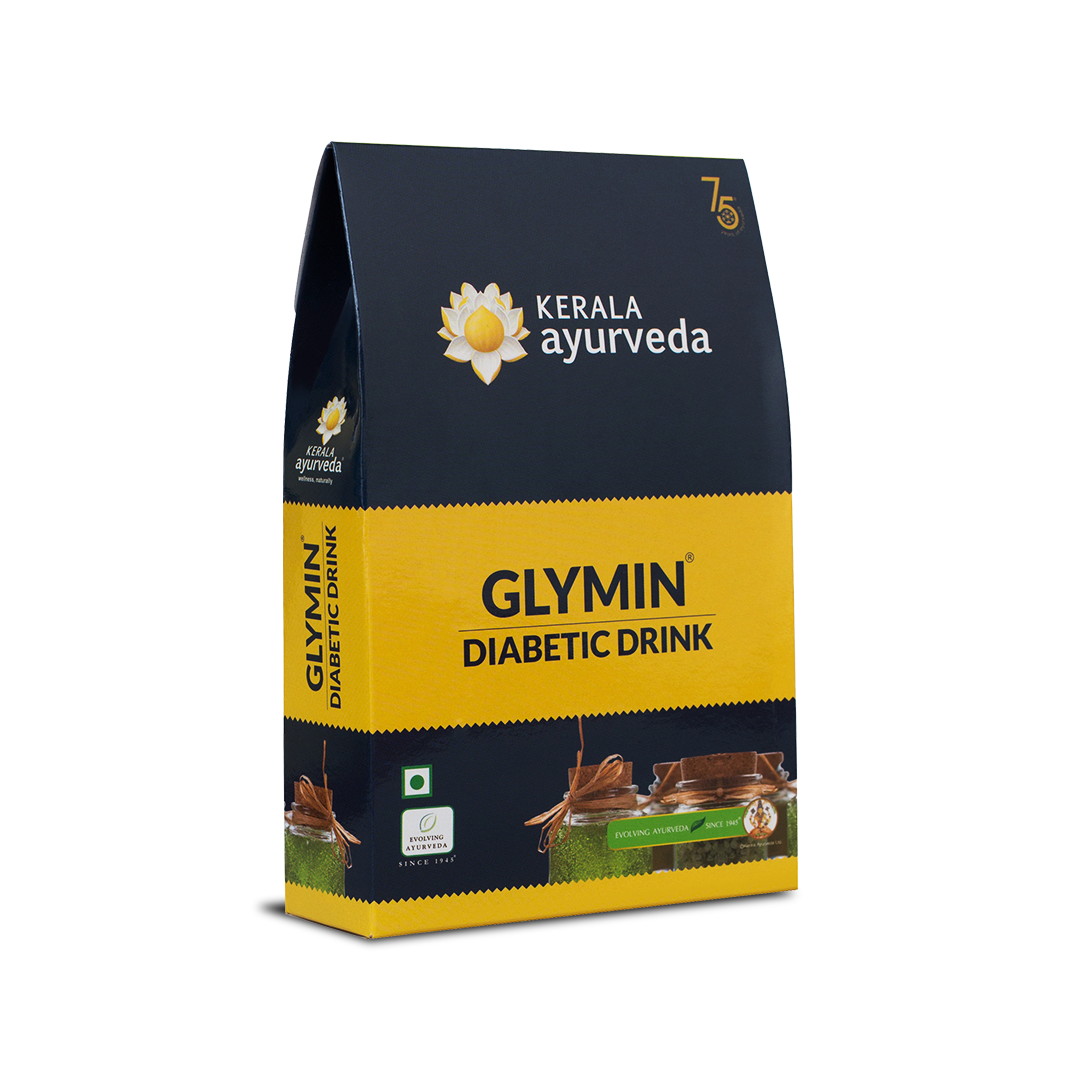 Angled front view of the Kerala Ayurveda Glymin Diabetic Drink box, showcasing its dark blue and yellow design with the brand logo and product name. – Kerala Ayurveda India