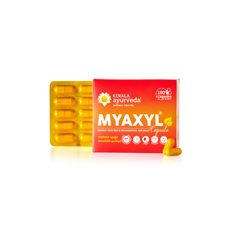 Front view of a red and yellow box of Kerala Ayurveda Myaxyl Capsules, with a blister pack of yellow capsules beside it. The box states "MYAXYL® Capsule" and "MANAGE YOUR PAIN & INFLAMMATION, NATURALLY." – Kerala Ayurveda India