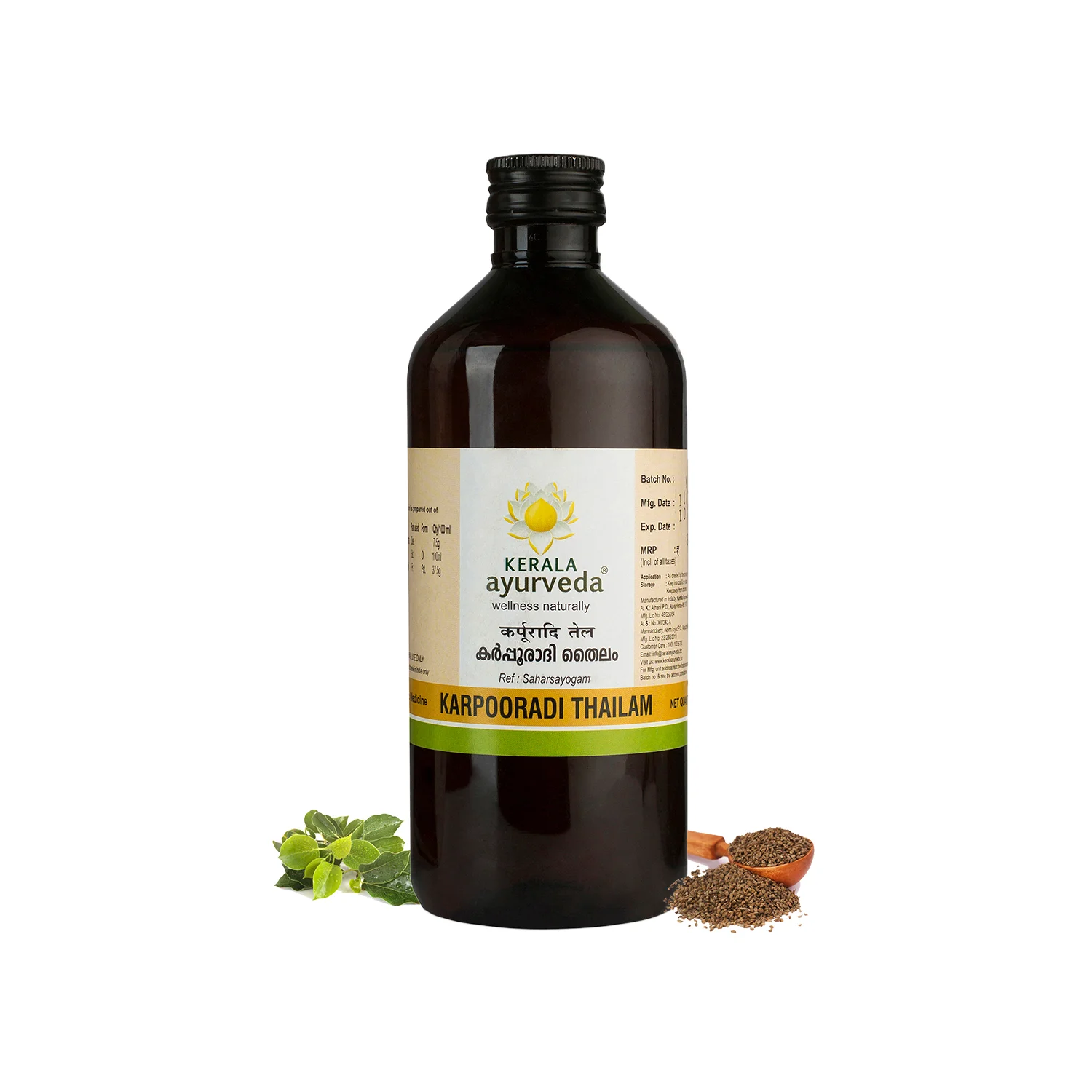 Front view of a 450ml dark brown glass bottle of Kerala Ayurveda Karpooradi Thailam, with the product name in English and Malayalam, surrounded by fresh mint leaves and carom seeds. – Kerala Ayurveda India